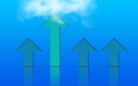 Success and Leadership arrow concept. One arrow standing From the crowd and reaching the cloudsの写真素材