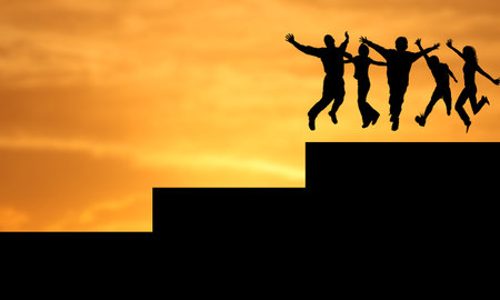 Silhouette of a group of happy people jumping on the top of a building