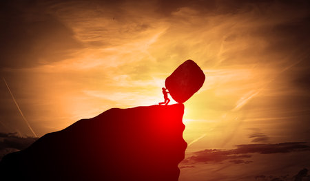 struggle, man, business, rock, push, hard, obstacle, challenge, effort, stone, heavy, pushing, hill, difficulty, determination, young, persistence, roll, overcoming, concept, strength, businessperson, success, impossible, boulder, uphill, person, metaphor, sunset, job, problem, pressure, task, big, sky, caucasian, men at work, hard worker, motivation, difficult, up, strong, conceptual, goal, copy space, orange, peopleの写真素材