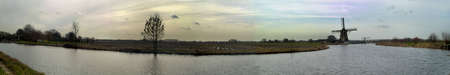 panorama of dutch mill in landscapeの写真素材