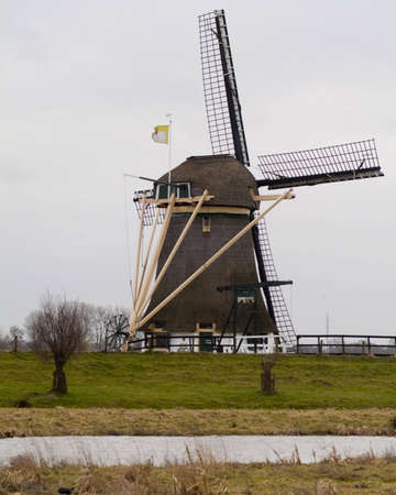 windmill in dutch landscapeの写真素材