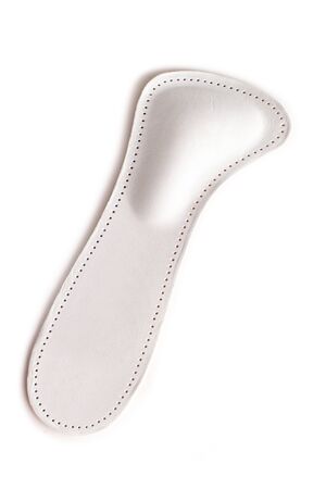 Medical insoles. Isolated orthopedic insoles on a white background. Treatment and prevention of flat feet and foot diseases. Foot care. Flat Feet Correction.の写真素材