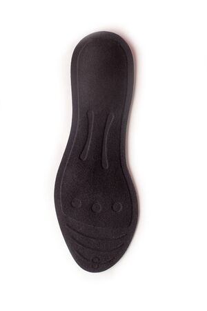 Isolated orthopedic insole on a white background. Treatment and prevention of flat feet and foot diseases. Foot care, comfort for the feet. Wear comfortable shoes. Medical insoles. Flat Feet Correction.の写真素材