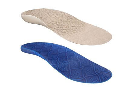 Isolated orthopedic insole on a white background. Treatment and prevention of flat feet and foot diseases. Foot care, comfort for the feet. Wear comfortable shoes. Medical insoles. Flat Feet Correction.の写真素材