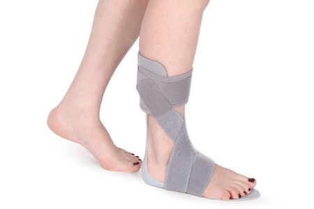 Orthopedic Ankle Brace. Medical Ankle Bandage. Medical Ankle Support Strap Adjustable Wrap Bandage Brace foot Pain Relief Sport. Leg Brace isolated on white backgroundの写真素材