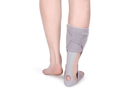 Orthopedic Ankle Brace. Medical Ankle Bandage. Medical Ankle Support Strap Adjustable Wrap Bandage Brace foot Pain Relief Sport. Leg Brace isolated on white backgroundの写真素材