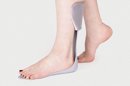 Orthopedic Ankle Brace. Medical Ankle Bandage. Medical Ankle Support Strap Adjustable Wrap Bandage Brace foot Pain Relief Sport. Leg Brace isolated on white backgroundの写真素材