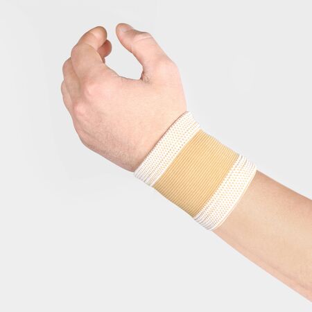 Elastic Wrist Bandage. Orthopedic medical Fitness Hand Bandage. Elastic Wrist Injury Support. Sport Protective Wristband. Wrist Positioning Orthosis. Wrist pain.の写真素材