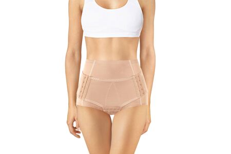 Postnatal Bandage. Medical Compression underwear. Orthopedic bandage underpants for lowering of the pelvic organs. Postpartum Tummy Control Belly Bandage. Female Bodyshaper. Postoperative bandageの写真素材