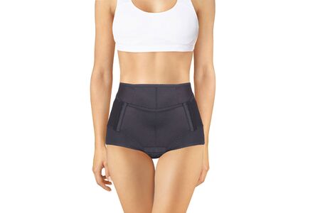 Postnatal Bandage. Medical Compression underwear. Orthopedic bandage underpants for lowering of the pelvic organs. Postpartum Tummy Control Belly Bandage. Female Bodyshaper. Postoperative bandageの写真素材