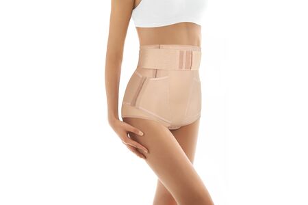 Postnatal Bandage. Medical Compression underwear. Orthopedic bandage underpants for lowering of the pelvic organs. Postpartum Tummy Control Belly Bandage. Female Bodyshaper. Postoperative bandageの写真素材
