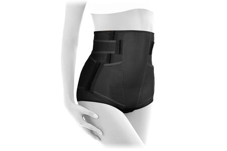 Postnatal Bandage. Medical Compression underwear. Orthopedic bandage underpants for lowering of the pelvic organs. Postpartum Tummy Control Belly Bandage. Female Bodyshaper. Postoperative bandageの写真素材