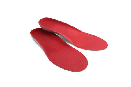 Isolated orthopedic insole on a white background. Treatment and prevention of flat feet and foot...