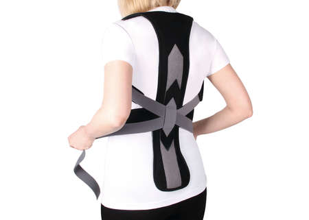 Orthopedic lumbar corset on the human body. Back brace, waist support belt for back. Posture...