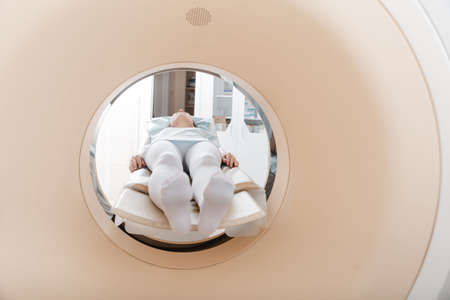 Medical CT or MRI Scan with a patient in the modern hospital laboratory. Interior of radiography department. Technologically advanced equipment in white room. Magnetic resonance diagnostics machine.の写真素材