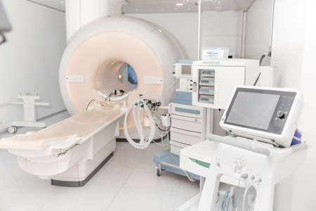 Medical CT or MRI Scan in the modern hospital laboratory. Interior of radiography department. Technologically advanced equipment in white room. Magnetic resonance diagnostics machine.の写真素材