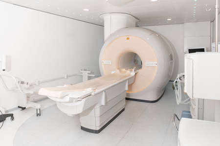 Medical CT or MRI Scan in the modern hospital laboratory. Interior of radiography department. Technologically advanced equipment in white room. Magnetic resonance diagnostics machine.の写真素材