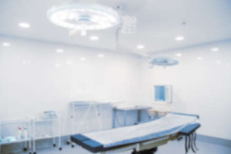 Abstract blur of hospital and clinic interior. Modern equipment in operating room. Medical devices for neurosurgery. Surgery instruments and surgical procedures. Background with blue filter.の写真素材