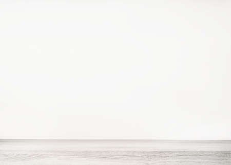 Empty white wood table top and blur wall. Wall Texture Background. Building banner mock up abstract background - can used for display or montage your products.の写真素材