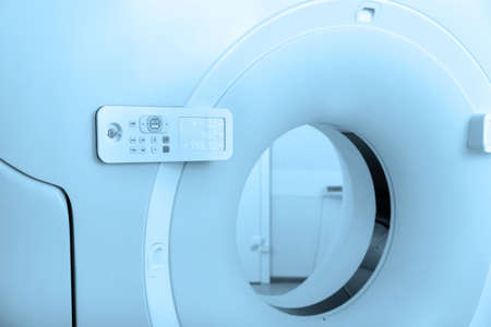 Medical CT or MRI Scan in the modern hospital laboratory. Interior of radiography department. Technologically advanced equipment in white room. Magnetic resonance diagnostics machine.の写真素材