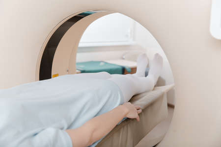 Medical CT or MRI Scan with a patient in the modern hospital laboratory. Interior of radiography department. Technologically advanced equipment in white room. Magnetic resonance diagnostics machine.の写真素材