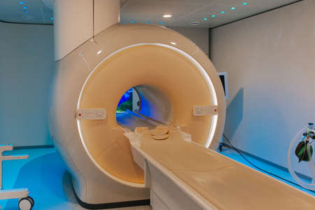 Medical CT or MRI Scan in the modern hospital laboratory. Interior of radiography department. Technologically advanced equipment in white room. Magnetic resonance diagnostics machine.の写真素材