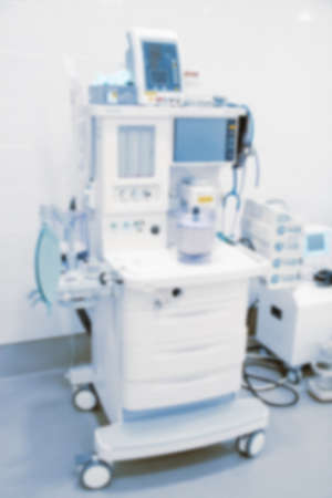 Abstract blur of hospital and clinic interior. Modern equipment in operating room. Medical devices for neurosurgery. Surgery instruments and surgical procedures. Background with blue filter.の写真素材