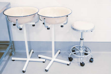 Empty operating room in a hospital. Surgical equipment with operating table. Medical device for...