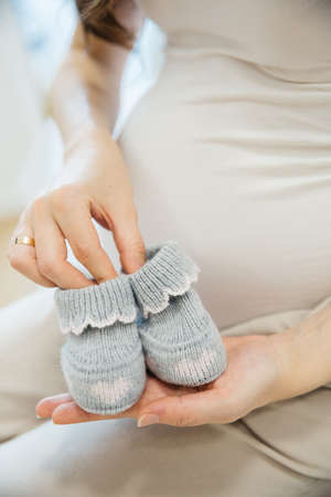 Pregnancy, motherhood, people and expectation concept - close up of happy pregnant woman with big...