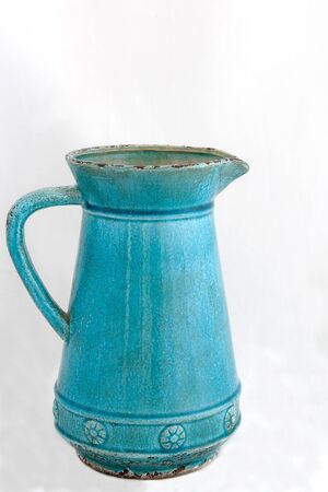 one big empty blue jug in retro style on light background, vintageの写真素材