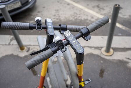 Moscow, Russia. 03-11-2020.  Parking place for electric scooters for rent. Handlebars of electric scooters in close-up on which instructions for use are applied.の写真素材