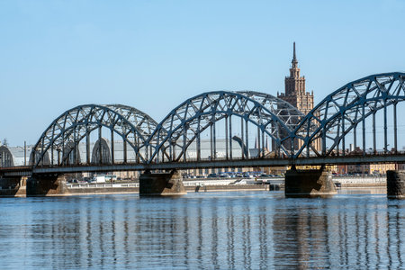 Riga, Latvia - 04.14.2019. Railway bridge over the river in the city center.