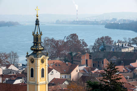 Belgrade, Zemun, Serbia. 12.23.2020. Panorama of the river, the old church and the city in the morning haze.のeditorial素材