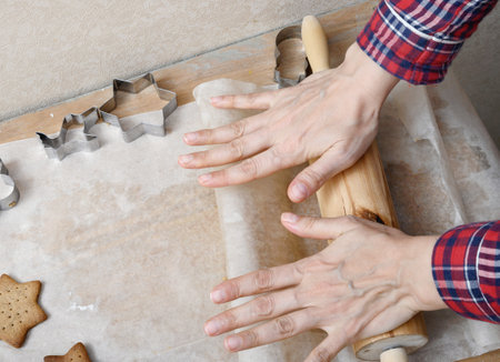 Womens hands in the process of making delicious home baking close-up.の写真素材
