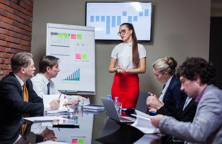 Woman making a presentation at meeting