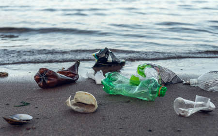 Plastic garbage lying on the beachの写真素材