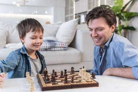 Father and son playing chess