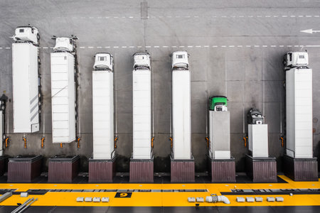 Top view of trucks loading in the distribution hubの写真素材