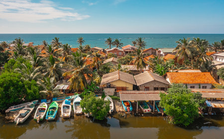 Aerial view of houses on the shoreline in Negombo. Negombo is a city on the west coast of Sri Lankaの写真素材
