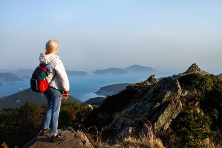 Mountains with heavy backpack Travel Lifestyle wanderlust adventure concept vacationsの写真素材