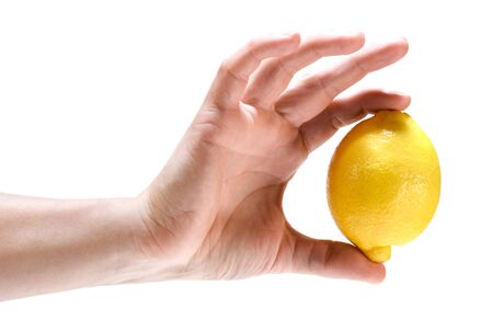 Lemon in hand isolated on white backgroundの写真素材