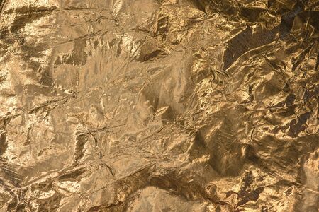 Crumpled gold foil texture