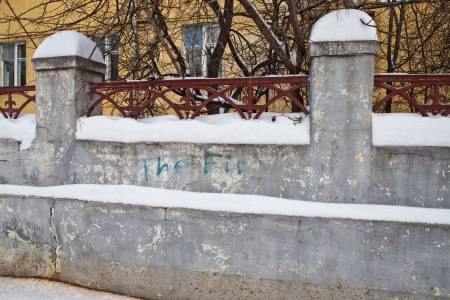 Old wall in the city in winterの写真素材