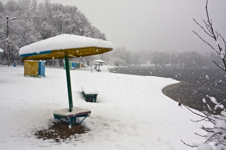 On the beach in the winter during a snowfallの写真素材