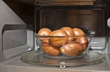 Potato tubers in the microwaveの写真素材