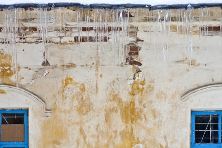 The wall of the old building with windowsの写真素材