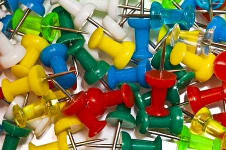 Many colorful stationery buttons close upの写真素材
