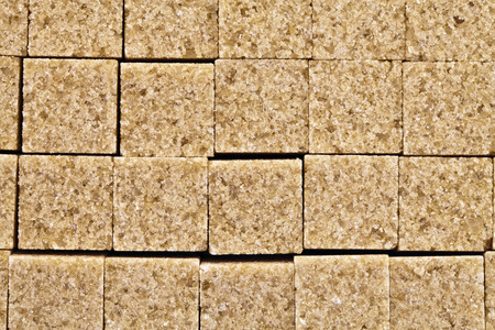Pieces of brown cane sugar, photographed close upの写真素材