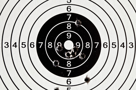 Paper target for airguns with holes from bulletsの写真素材