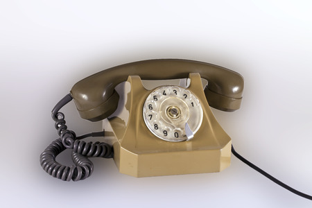 Old plastic telephone with a tube and a wireの写真素材